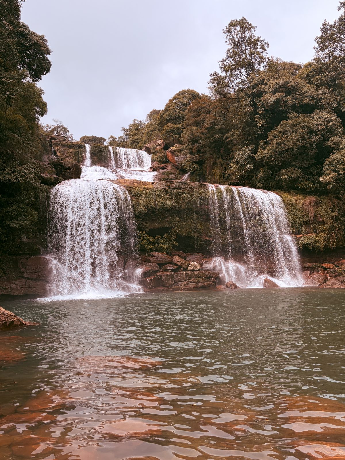 A waterfall spilling into a pool